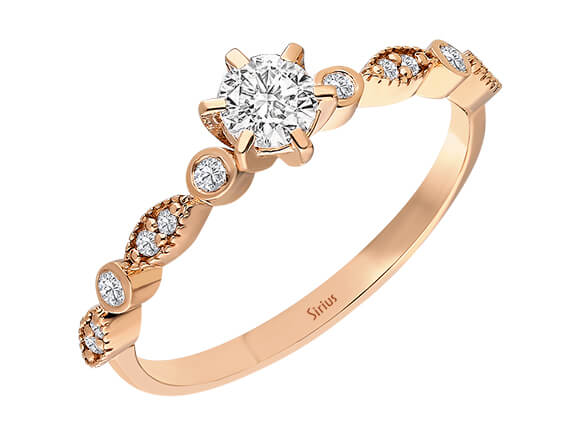 Bague en or rose avec diamant central de 0,25 ct et pierres latérales – Inanna