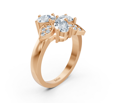 Rose gold ring with three oval lab diamonds and floral design