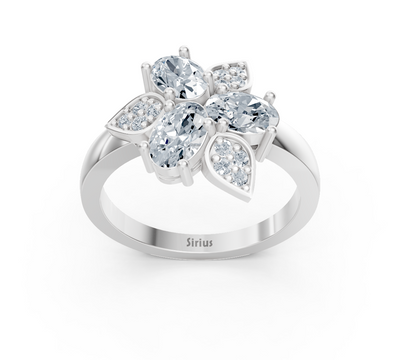 Design ring made of white gold with three oval lab diamonds and floral accent