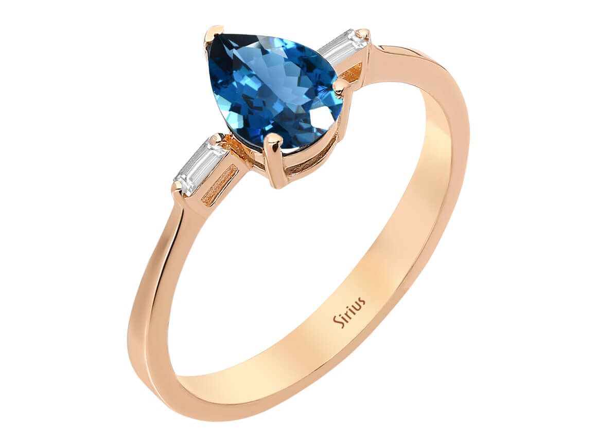 Royal blue topaz ring with baguette diamonds in 14K rose gold