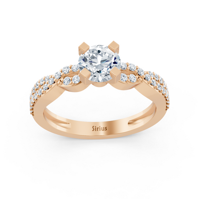 Bague en or rose avec diamant rond et topazes blanches pavées