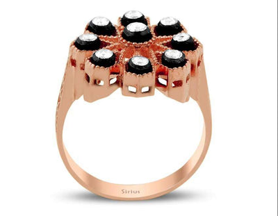 Flower-shaped rose gold ring with nine pairs of diamonds
