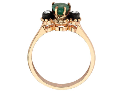 Fine rose gold ring with teardrop-shaped emerald and two round diamonds
