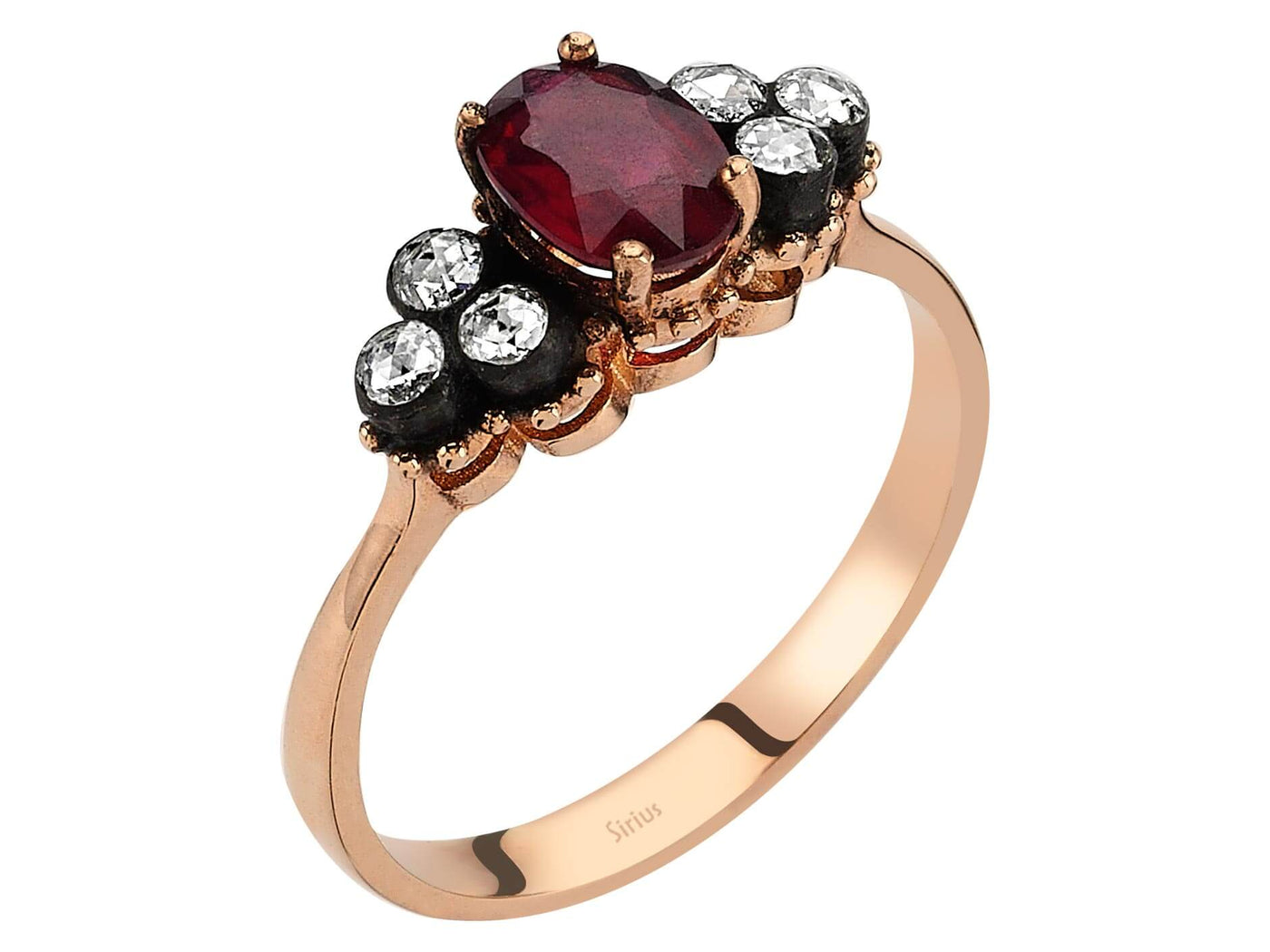 Elegant ring with oval ruby and six round diamonds in rose gold