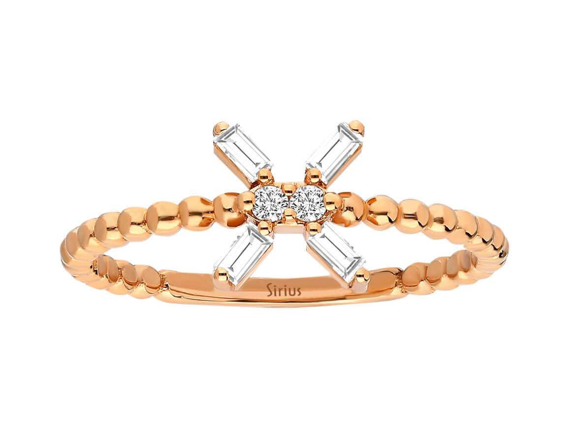 Bague en or rose avec diamants de laboratoire baguette et ronds en design croisé