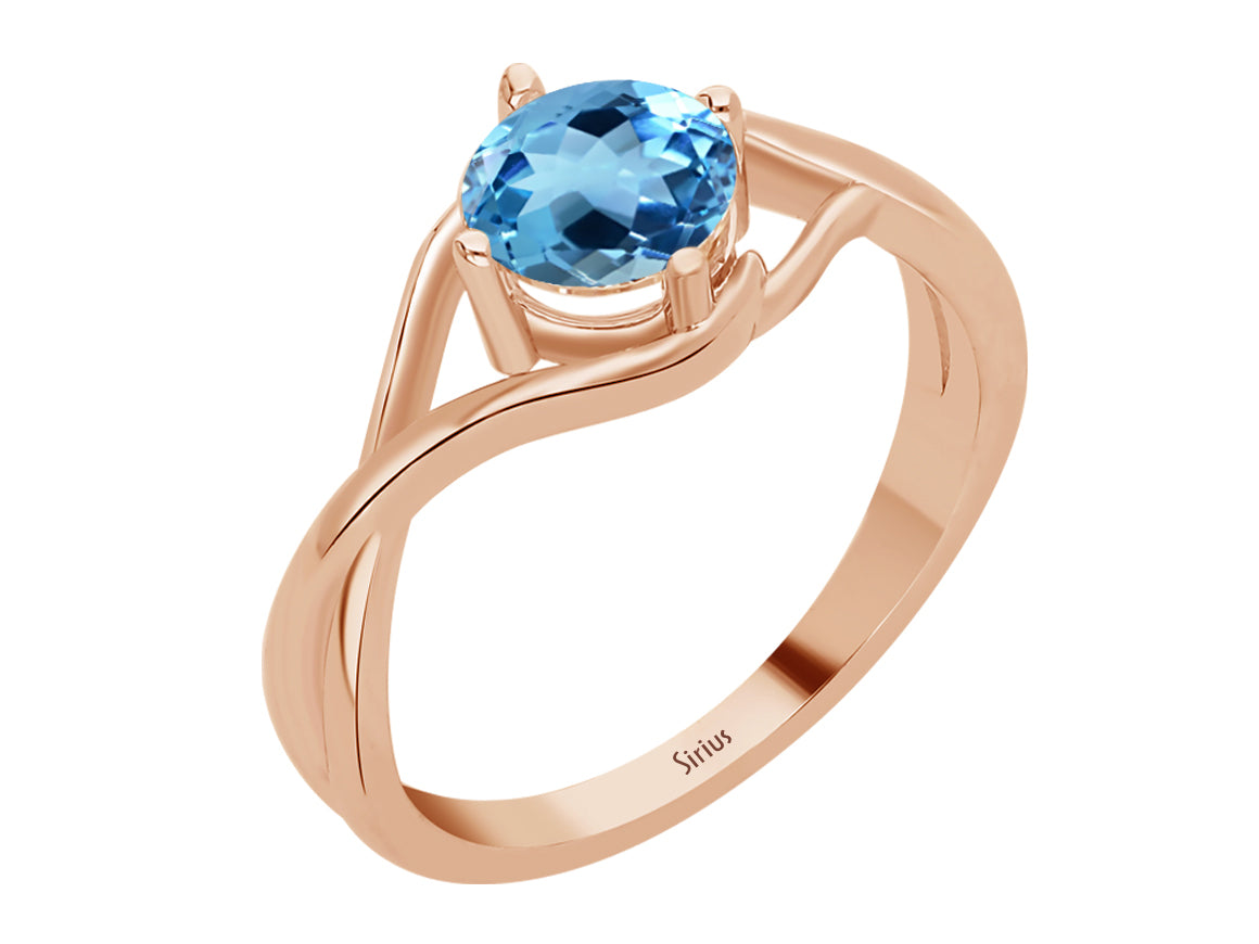 Moana ring with round cut mystic blue topaz in rose gold