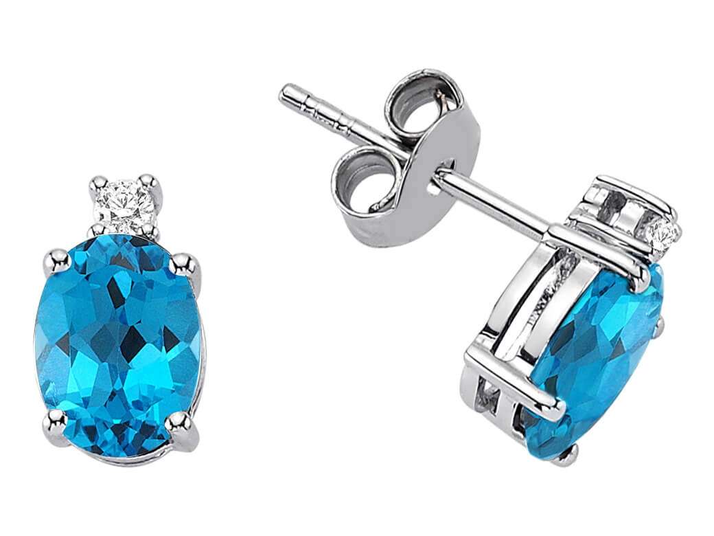 Clous d'oreilles en topaze bleue ovale avec diamants en or blanc 8K