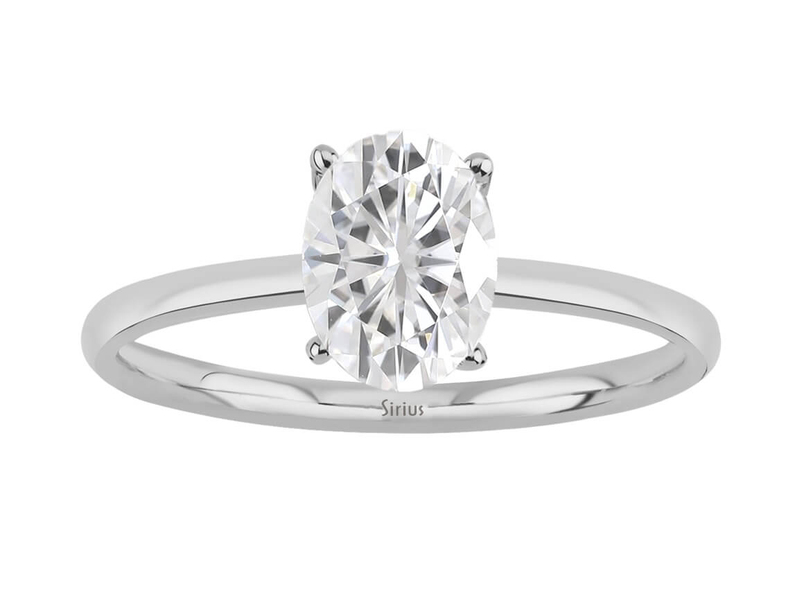 Simple solitaire ring with 1.60 ct oval white topaz in white gold