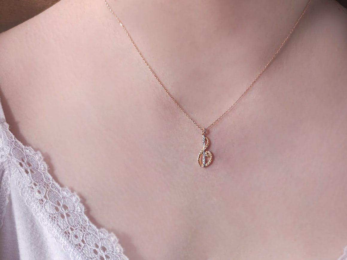 Rose gold necklace with musical symbol and 45 round-cut lab diamonds – 04P0173