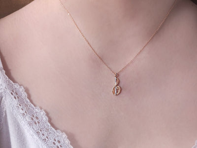 Rose gold necklace with musical symbol and 45 round-cut lab diamonds – 04P0173