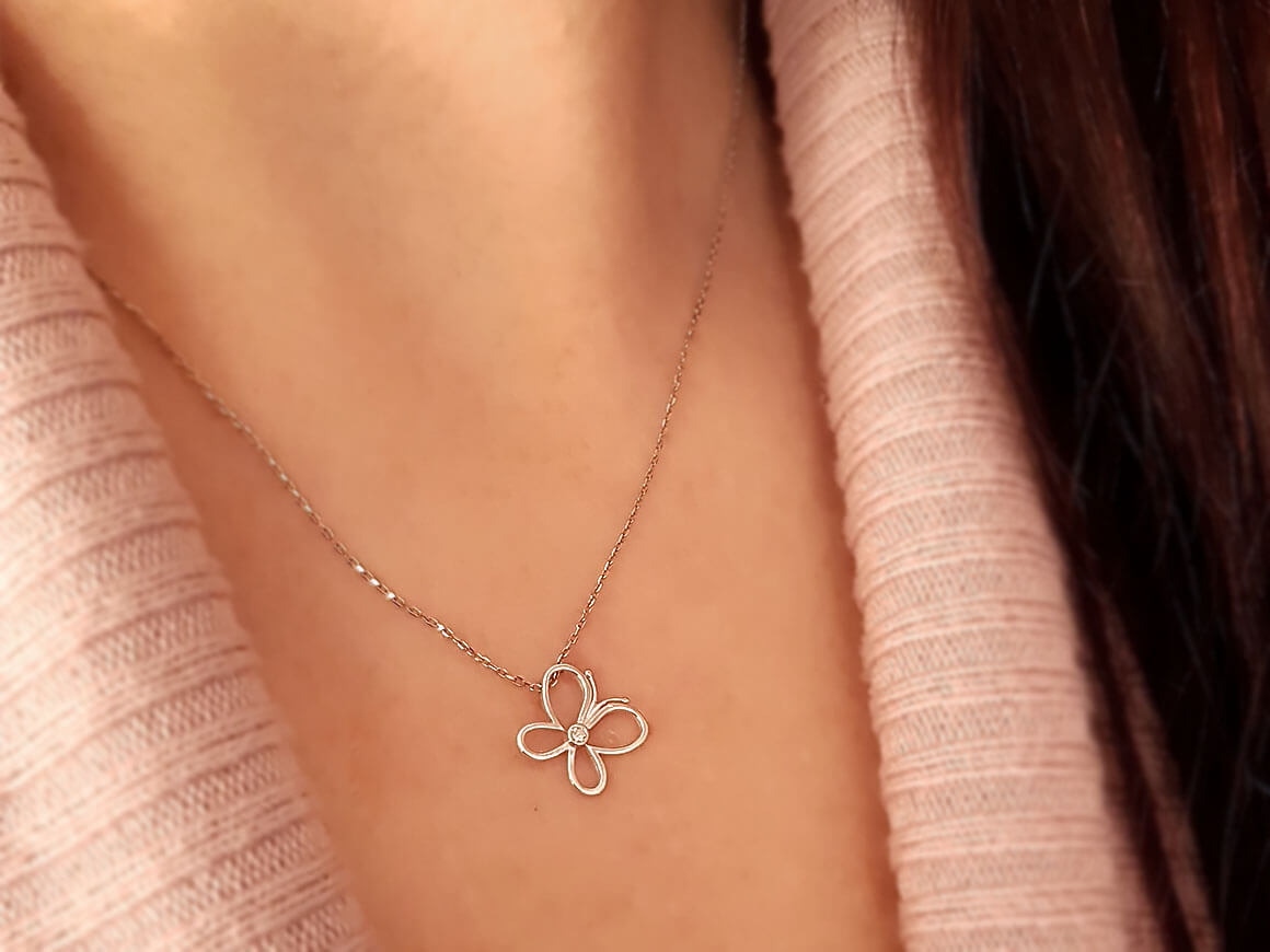 Minimalist butterfly necklace with a lab diamond in 8K white gold