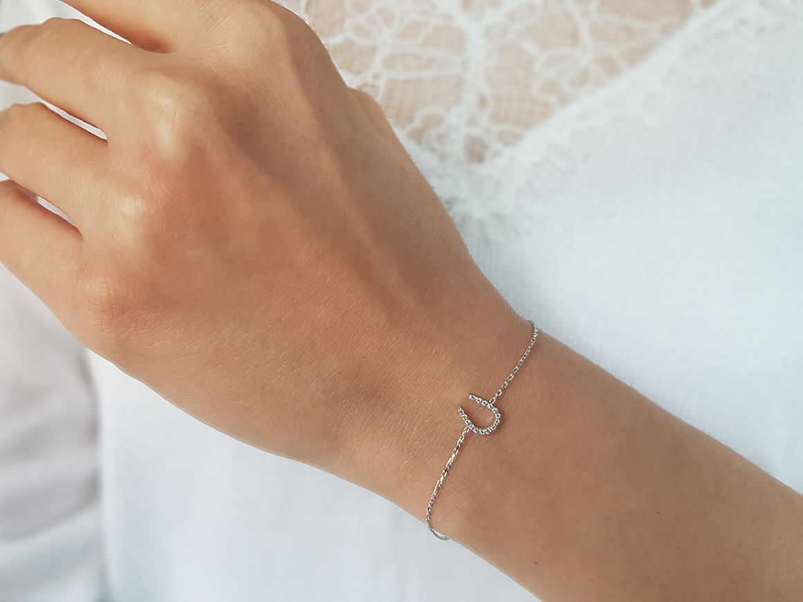 Fine horseshoe bracelet with diamonds in 14K white gold