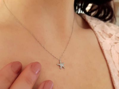 Starfish pendant with 26 diamonds made of 18K white gold