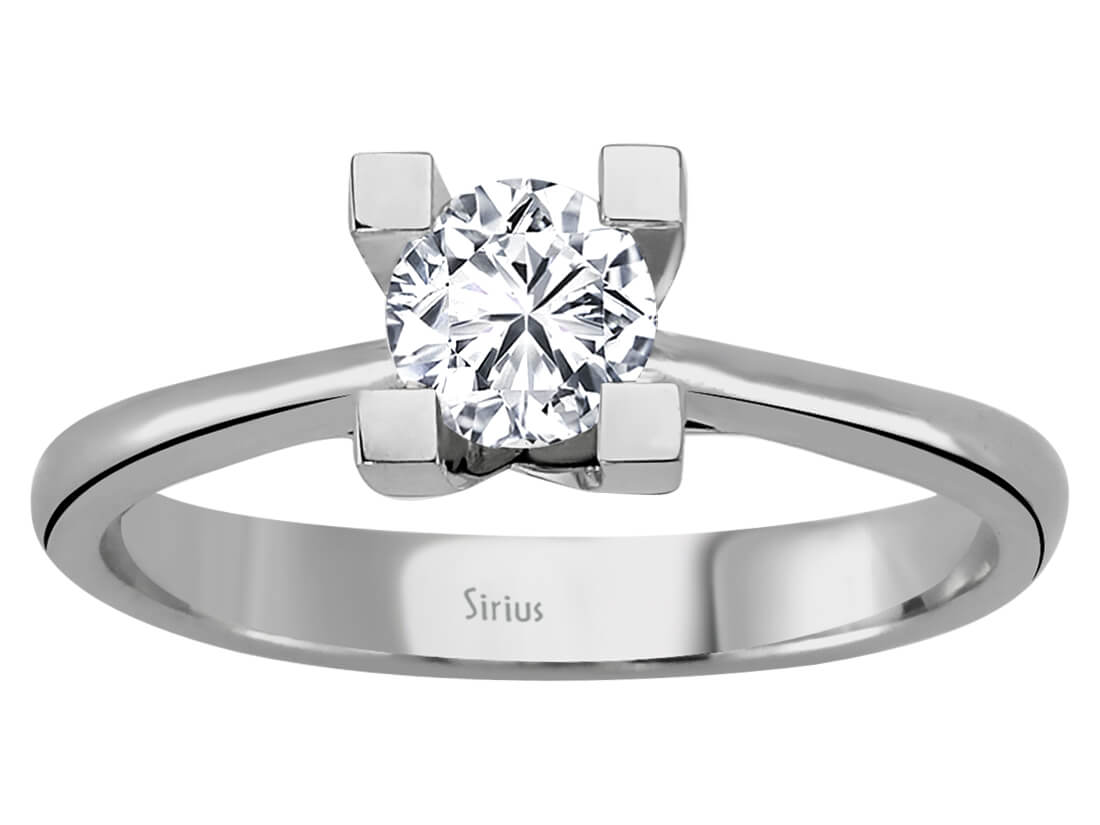 Simple solitaire ring with round diamond in white gold