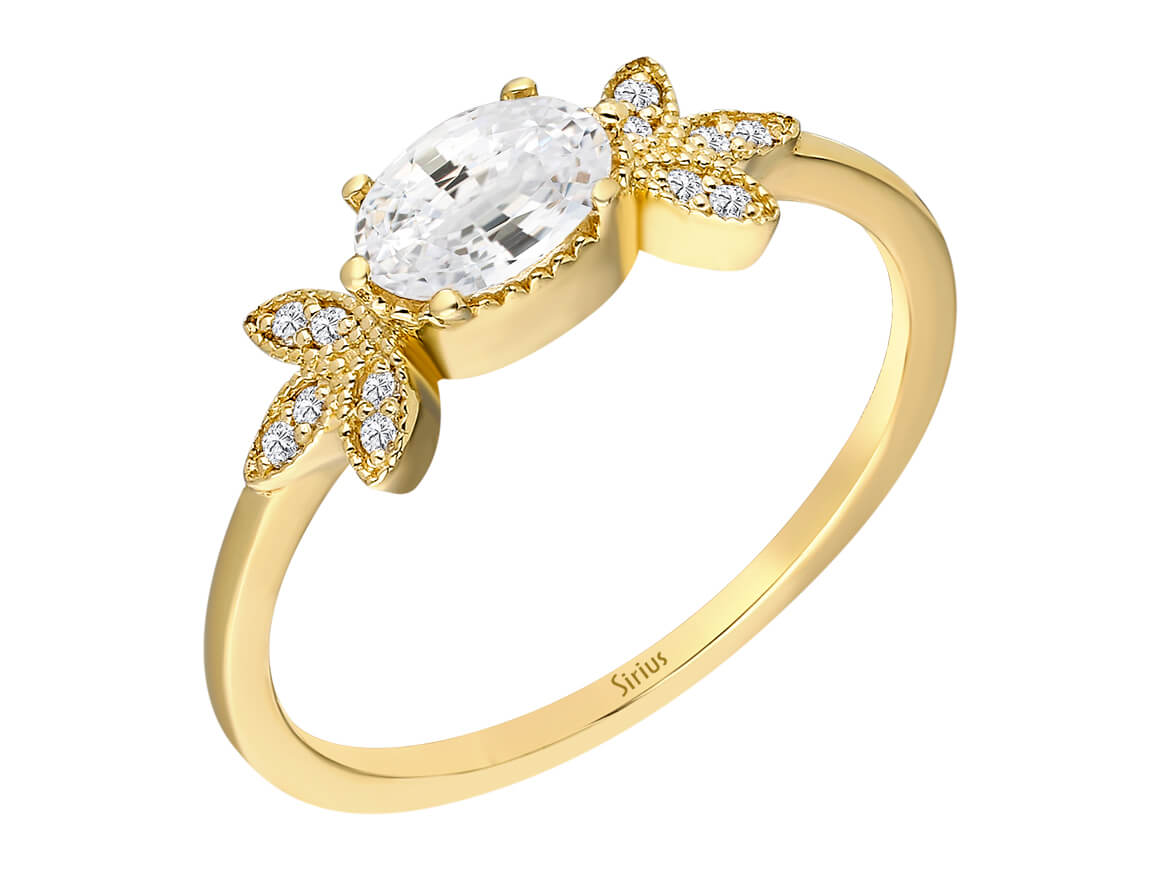 Bague en or jaune avec topaze blanche ovale et feuilles de diamant – 0,70 ct
