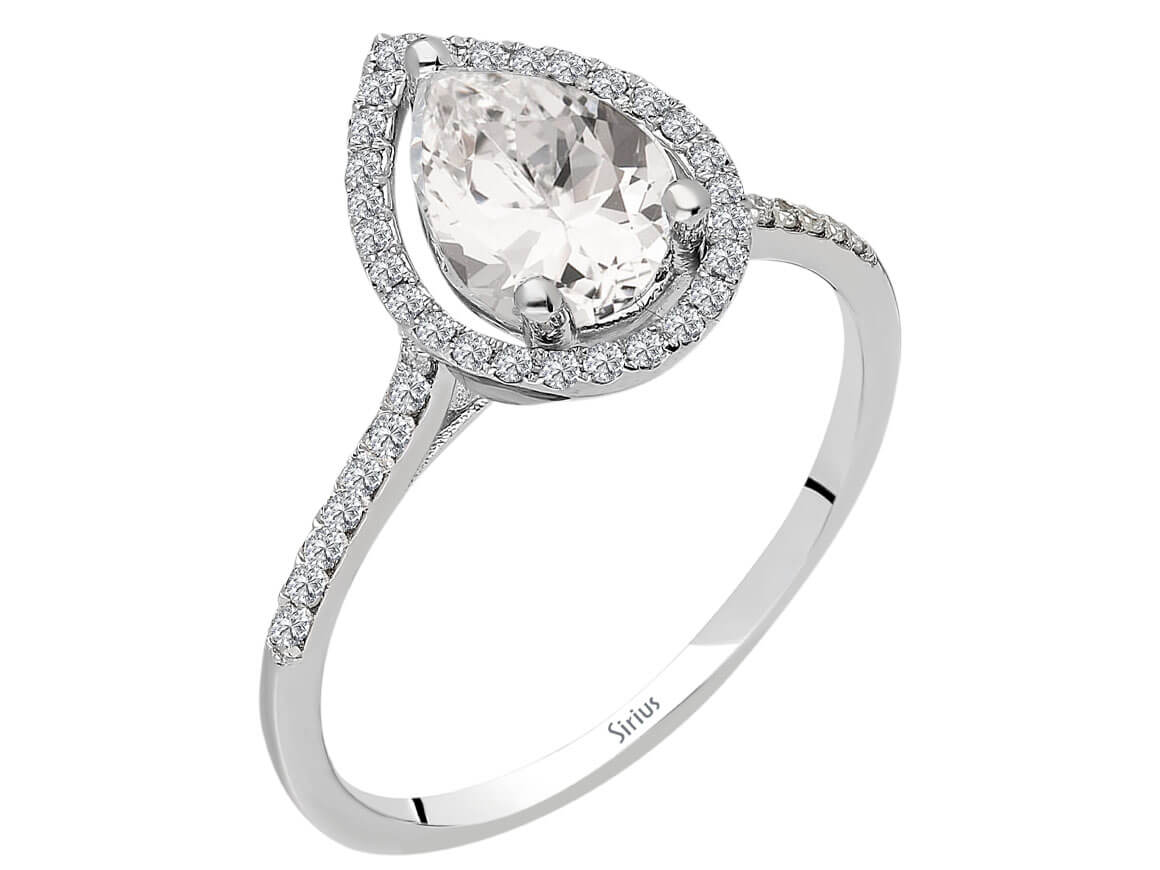 Radiant diamond and white topaz ring with pear cut