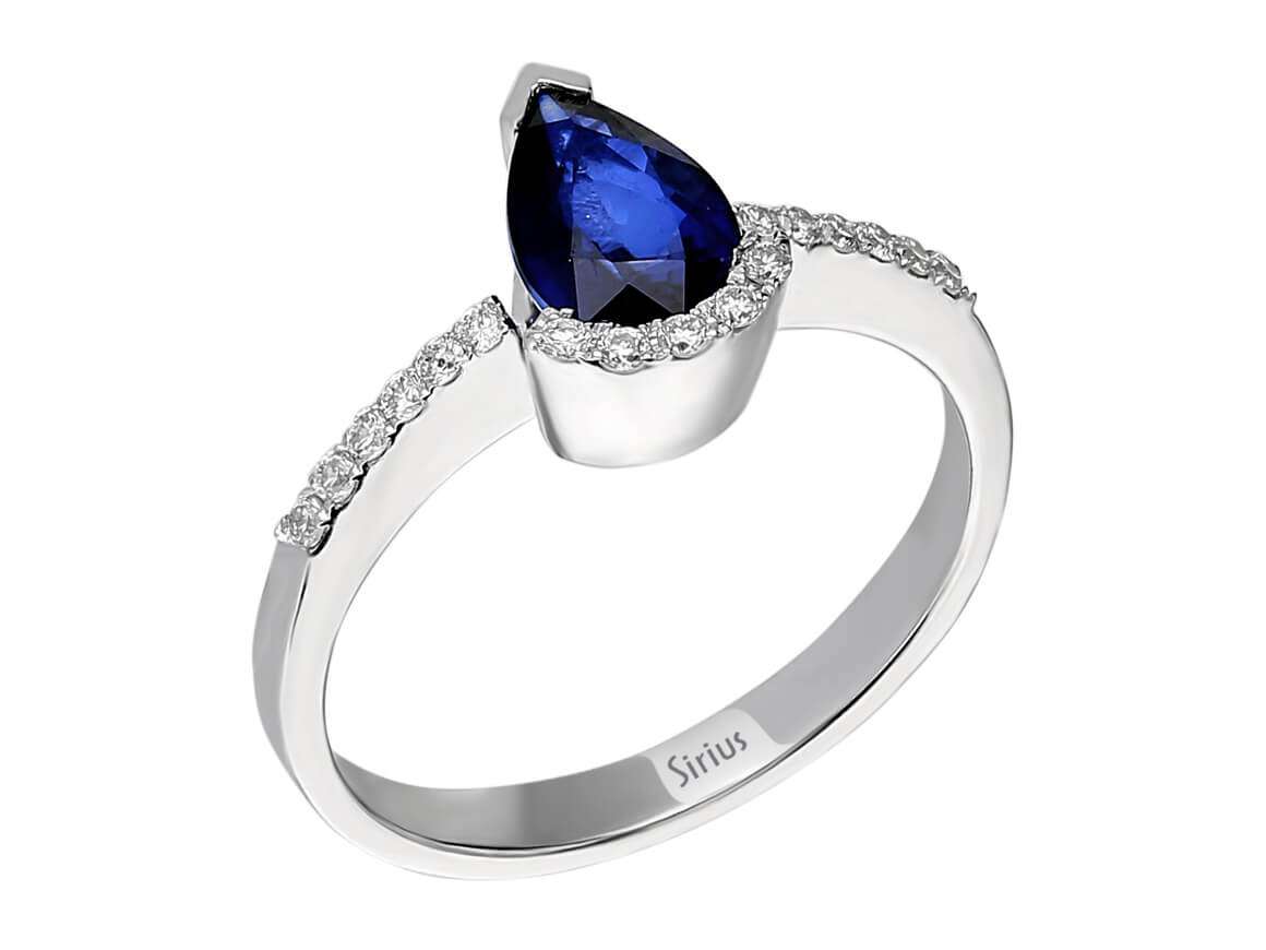 Elegant laboratory diamond and teardrop sapphire ring made of 14 karat white gold