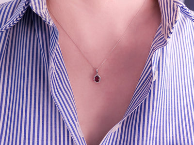 Anturaj pendant with ruby in teardrop shape and diamonds – 14K white gold