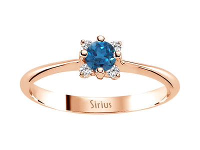 Rose gold ring with 4 diamonds and 1 round London blue topaz