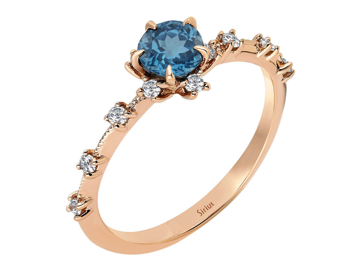 Rose gold ring with 0.71 carat London blue topaz and diamonds, 14K