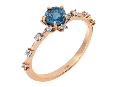 Rose gold ring with 0.71 carat London blue topaz and diamonds, 14K