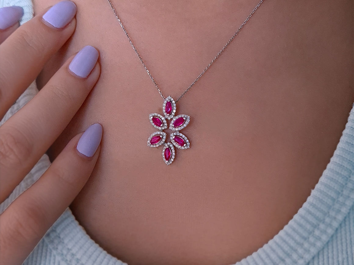 Elegant flower necklace with marquise-cut rubies and diamonds in 14K white gold