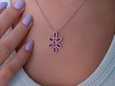 Elegant flower necklace with marquise-cut rubies and diamonds in 14K white gold
