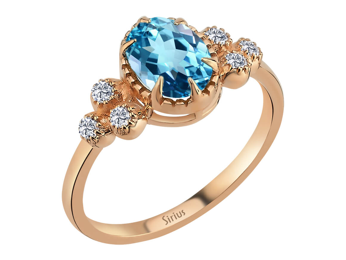 Marjatta ring with oval blue topaz and lab diamonds in 8K rose gold
