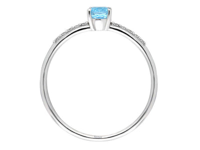 Fine white gold ring with oval blue topaz and pavé diamonds