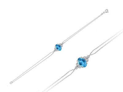 Fine bracelet with oval blue topaz and 6 lab-grown diamonds