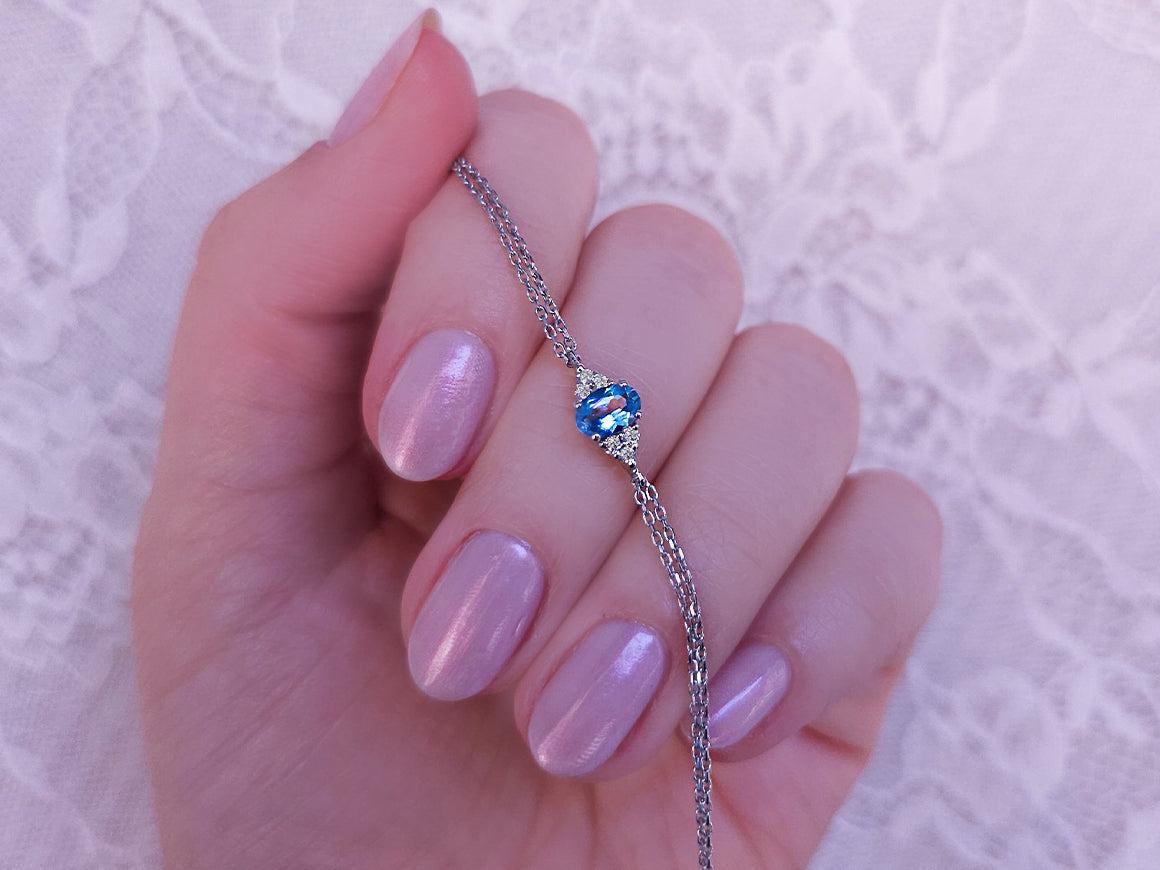 Fine bracelet with oval blue topaz and 6 lab-grown diamonds