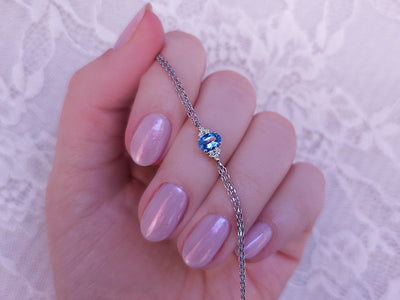 Fine bracelet with oval blue topaz and 6 lab-grown diamonds