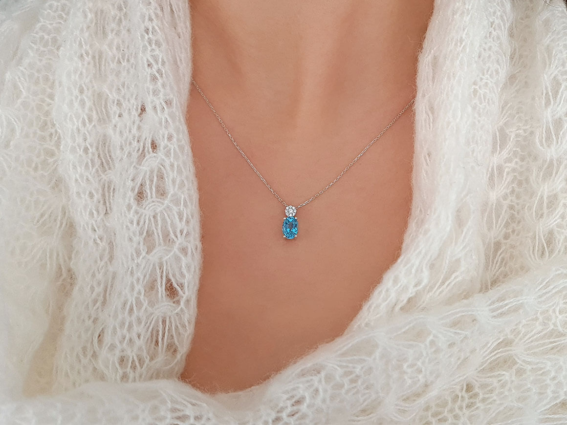 Pendant with Oval Blue Topaz & 9 Lab Diamonds – 8K White Gold