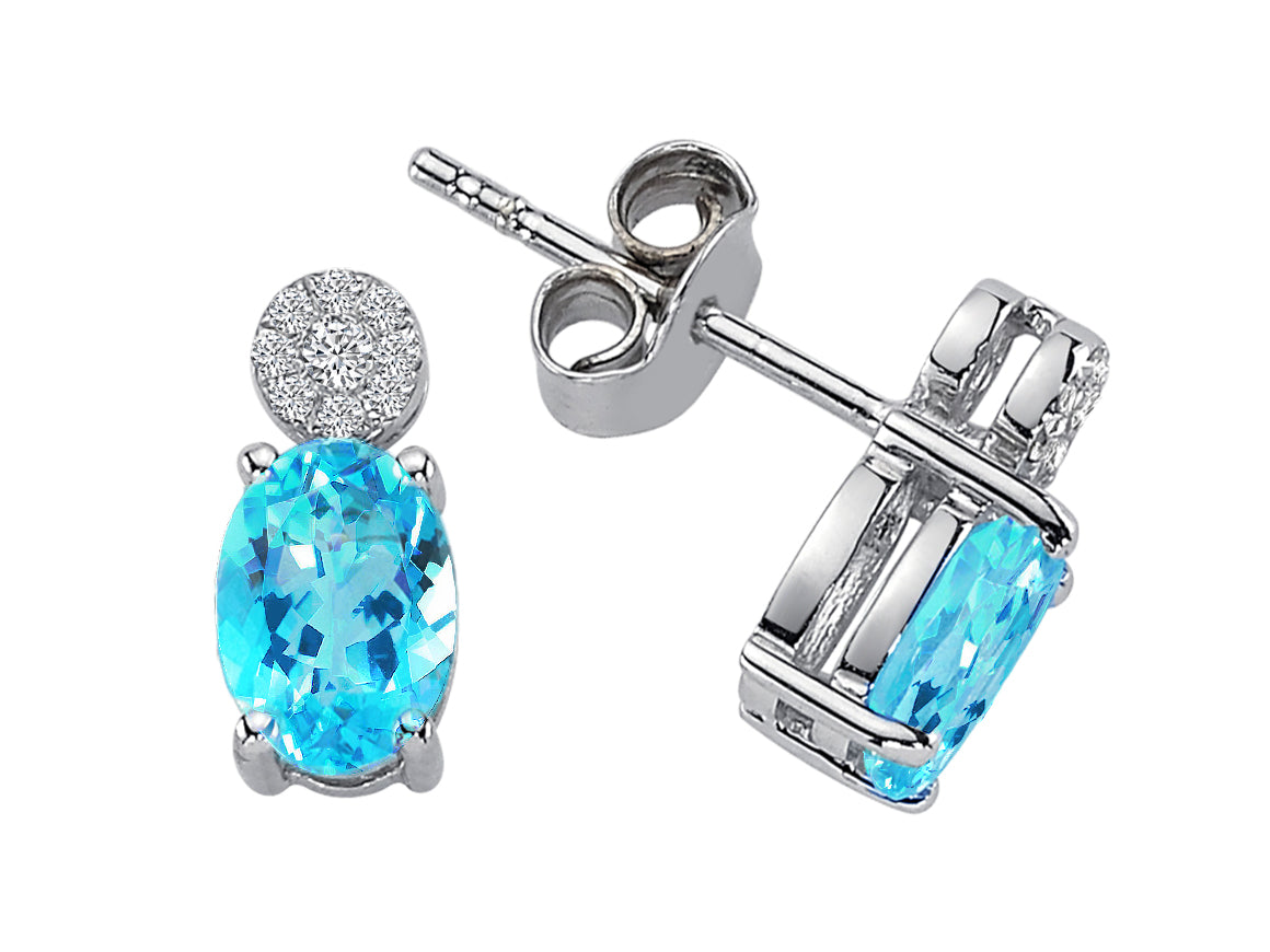 Clous d'oreilles avec topazes bleues ovales et diamants en or blanc 333‰