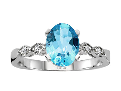Weißgold Ring mit 4 rund geschliffenen Diamanten und 1 ovalen blauen Topas – 14K