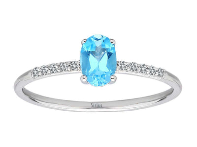 Fine white gold ring with oval blue topaz and pavé diamonds