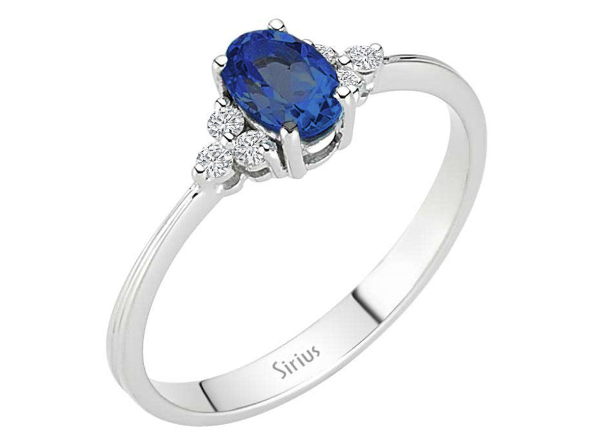 Elegant 8 Carat White Gold Ring with 6 Round Diamonds and an Oval Sapphire