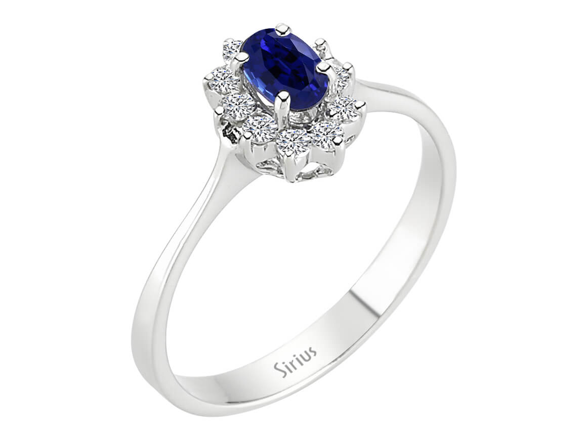 Eleganter Ring mit 10 rund geschliffenen Diamanten und 1 ovalem Saphir, 14 Karat Weißgold