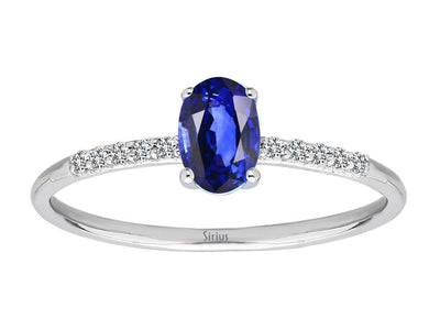 Fine laboratory diamond and oval sapphire ring in 14 karat white gold