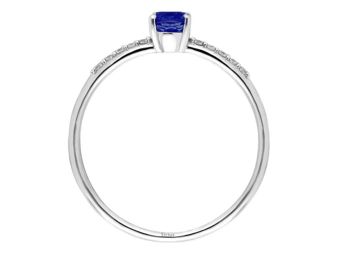 Fine laboratory diamond and oval sapphire ring in 14 karat white gold