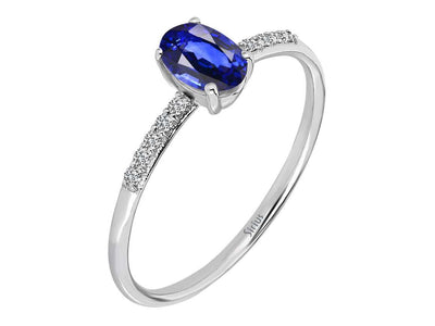 Fine laboratory diamond and oval sapphire ring in 14 karat white gold