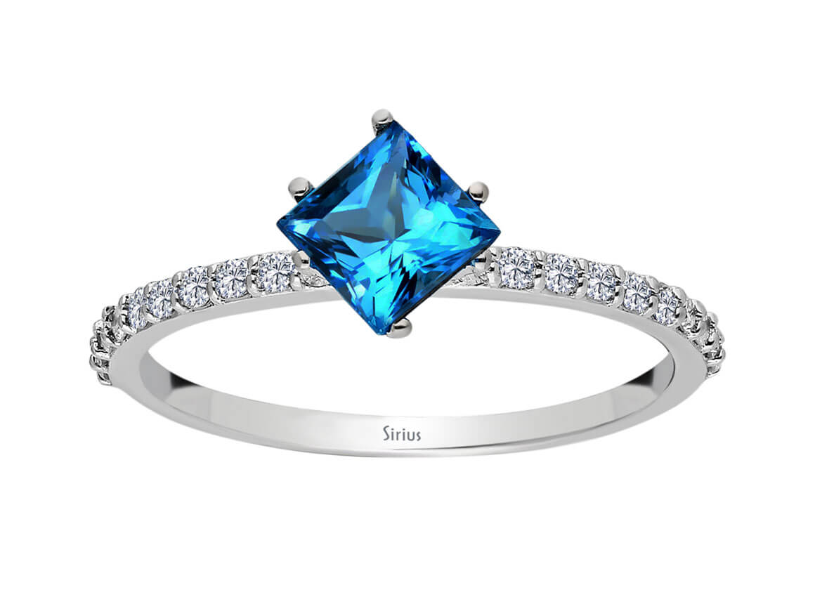 Sparkling diamond and London blue topaz ring with princess cut