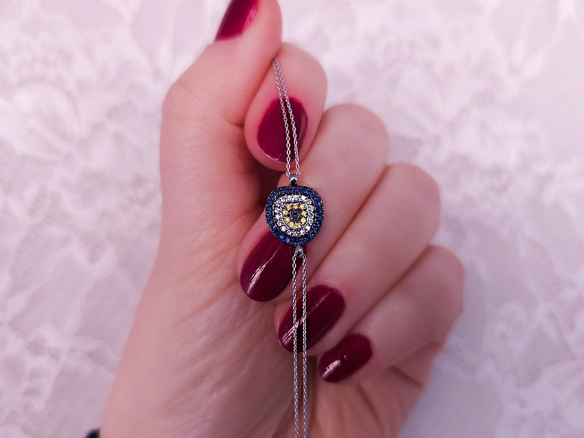 Nazar bead bracelet with sapphires and diamonds made of 14K white gold – 0.27 carat