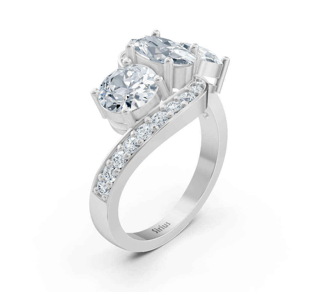 Rosy Lab Diamonds'ın Beyaz Altın Sirius üç taşlı yüzüğü; oval ve yuvarlak pırlantalarla sunulan yüksek kaliteli Mücevher
