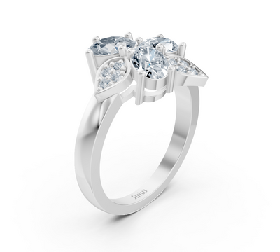 Design ring made of white gold with three oval lab diamonds and floral accent