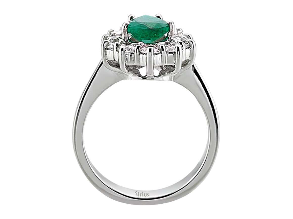 Eleganter Anturajring mit 12 Rundschliff-Diamanten und 1 Tropfen-Smaragd in 14 Karat Weißgold